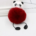 Detail of cute panda plush keychain with large dark red faux fur pompom and PU leather face - Burgundy