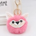 Detailed macro view of pink faux fur fox keychain with sequins and gold metal hardware - Gold Key Chain Style / Deep Pink