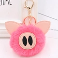 Close-up of pink fluffy pig keychain showing soft plush texture and gold hardware - Gold Key Chain Style / Watermelon red