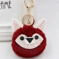 Detail showing red faux fur fox pompom keychain with golden clasp and glitter ears - Gold Key Chain Style / Burgundy