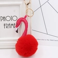 Detail of flamingo keychain with red faux fur pompom and gold lobster clasp for bags - Red and Rose
