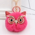 Detail of rose pink owl pompom keychain featuring red sequined ears and golden metal clasp - Gold Key Chain Style / Rose Red