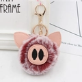 Close-up of cute plush pig keychain with pink leather ears and gold metal clasp hardware - Gold Key Chain Style / Two-tone Wine Red