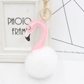 Close-up of pink flamingo keychain with white faux fur pompom and gold lobster clasp - White and Pink