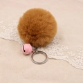 Detailed macro view of soft brown faux fur pompom keychain with a pink bell - 8cm Faux Rabbit Fur With Bell / Coffee