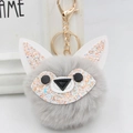 Detailed macro view of gray faux fur fox keychain with colorful sequins and golden clasp - Gold Key Chain Style / Light Gray