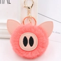 Detailed view of pink faux fur pig keychain with leather ears and golden metal lobster clasp - Gold Key Chain Style / Orange Red