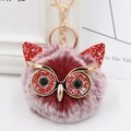 Close-up of red sequin owl plush keychain with faux fur and golden lobster clasp - Gold Key Chain Style / Two-tone Wine Red