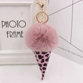 Close-up of a pink plush faux fur pom pom keychain with leopard print ice cream cone - Gold Key Chain Style / Dusty Pink