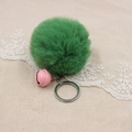 Detail of emerald green faux fur pompom keychain with a small pink bell and silver ring - 8cm Faux Rabbit Fur With Bell / Army Green