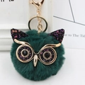 Detail of owl plush keychain featuring dark green faux fur and shiny sequins - Gold Key Chain Style / Dark Green Black