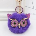 Close-up of a purple sequined owl plush keychain with a gold ring and lobster clasp - Gold Key Chain Style / Purple