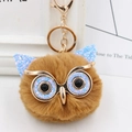 Close-up of brown plush owl keychain with blue glitter accents and gold metal clip - Gold Key Chain Style / Coffee Blue