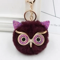 Detail view of purple plush owl keychain with gold sequins and luxury faux fur - Gold Key Chain Style / Purple Red