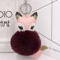 Detail of cute fox plush keychain with fluffy burgundy pom pom and pink leather trim - Silver Keyring / Fuschia