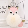 Detail of cute fox plush keychain with faux leather stitching and fluffy fur ball - Silver Keyring / Off White