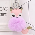 Close-up of cute fox keychain with fluffy purple faux fur ball and pink leather details - Silver Keyring / Taro Purple