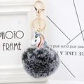 Unicorn keychain with gray and white faux fur pompom and golden metal clip - Two-tone Black