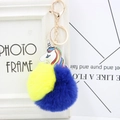 Colorful unicorn keychain with yellow and dark blue faux fur pompom and gold ring - Yellow + Royal Blue