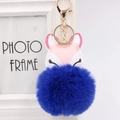 Detail of fox PU leather keychain with gold clasp and fluffy blue faux fur ball charm - Sapphire Blue