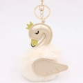 Detail of swan bag charm with champagne PU leather, gold crown and soft plush pom pom - Cream White-Champagne