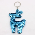 Detailed close-up of blue sequined giraffe keychain with silver metal ring for bags - Blue