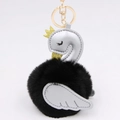 Detail of swan faux fur pompom keychain with silver leather wings and golden crown - Black-Silver