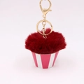 Detail of creative cupcake plush keychain with fluffy dark red ball and pink base - Burgundy