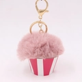 Detailed view of pink pompom cupcake plush keychain with striped base and gold clasp - Dusty Pink