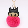 Detailed close-up of a plush keychain featuring a black faux leather head and pink pompom - Rose Red