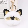 Llavero de gato de peluche blanco con bigotes dorados y nariz de corazón para bolso - Blanco