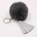 Close-up of fluffy dark grey pompom with elegant long silver tassels on a silver keychain - 8cm Faux Rabbit Fur Tassel Style / Dark Grey