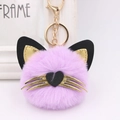 Detailed close-up of a purple plush cat head keychain with gold whiskers and heart nose - Taro Purple