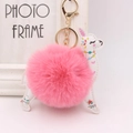 Detail of alpaca plush keychain with pink pom-pom, white leather, and gold lobster clasp - Deep Pink