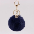 Detail of navy faux rabbit fur keychain with gold lobster clasp and crystal cube pendant - Navy Blue
