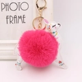 Detail showing the white PU leather alpaca charm with a magenta faux fur pom pom keychain - Rose Red