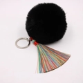 Detailansicht eines schwarzen Kunstfell-Bommel mit buntem Regenbogen-Quastenanhänger - (Bunte Quaste)-8cm Künstliches Kaninchenfell / Schwarz