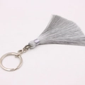 Detailed macro view of silky silver-grey bohemian tassel pendant with metallic key ring - Silver Single Ring / Gray
