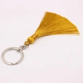 Macro detail of golden yellow silk tassel with silver metal keyring for bag accessories - Silver Single Ring / Champagne Gold