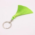 Detail of neon green tassel keychain with polished silver metal ring on white background - Silver Single Ring / Fruit Green