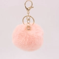 Detailed view of soft pink faux rabbit fur pompom with golden metal clasp and key ring - Pink