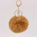 Detail of brown faux rabbit fur keychain with gold ring and crystal gem pendant - Coffee