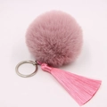 Detailed macro view of a pink faux fur pom-pom with silky fringe and silver keychain - 8cm Faux Rabbit Fur Tassel Style / Bean Paste Pink
