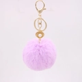 Detail of light purple faux fur pompom keychain with gold lobster clasp and pearl shell charm - Taro Purple