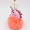 Close-up of pink unicorn pompom keychain with golden metal ring and lobster clasp - Unicorn Keychain / Orange Red