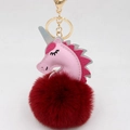 Close-up of pink unicorn pompom keychain with golden metal clasp and fluffy red faux fur - Unicorn Keychain / Burgundy
