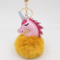 Close-up of pink leather unicorn head with yellow fluffy pom pom and golden keychain clasp - Unicorn Keychain / Orange