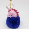 Detailed shot of pink unicorn head with blue fluffy pom pom and golden metal keychain - Unicorn Keychain / Sapphire Blue