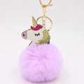 Portachiavi con pompon in ecopelliccia di unicorno e chiusura dorata per borse da donna - Viola Taro