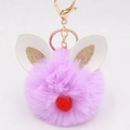 Close-up of purple faux fur keychain with bunny ears and gold lobster clasp - Bunny Ear Pom Pom Keychain / Taro Purple